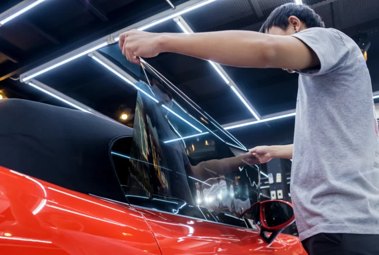 applying-tinting-foil-car-window-auto-service